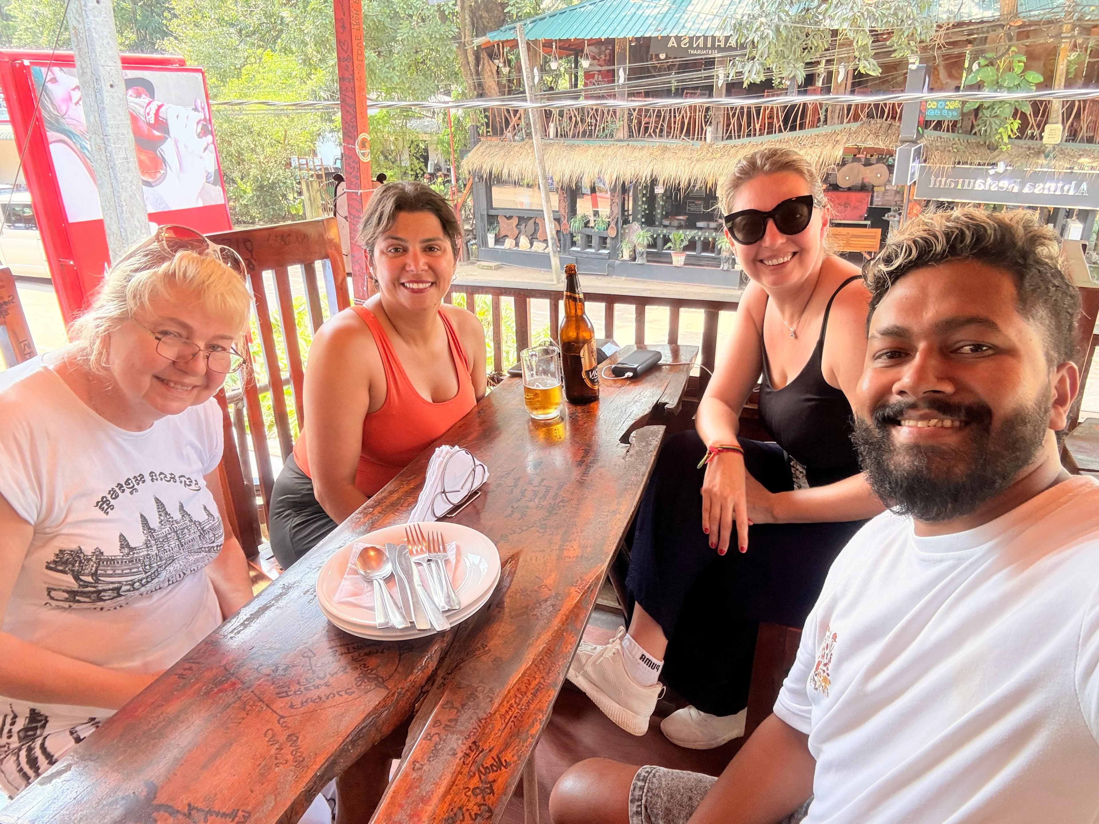 Friends gathered around a restaurant table