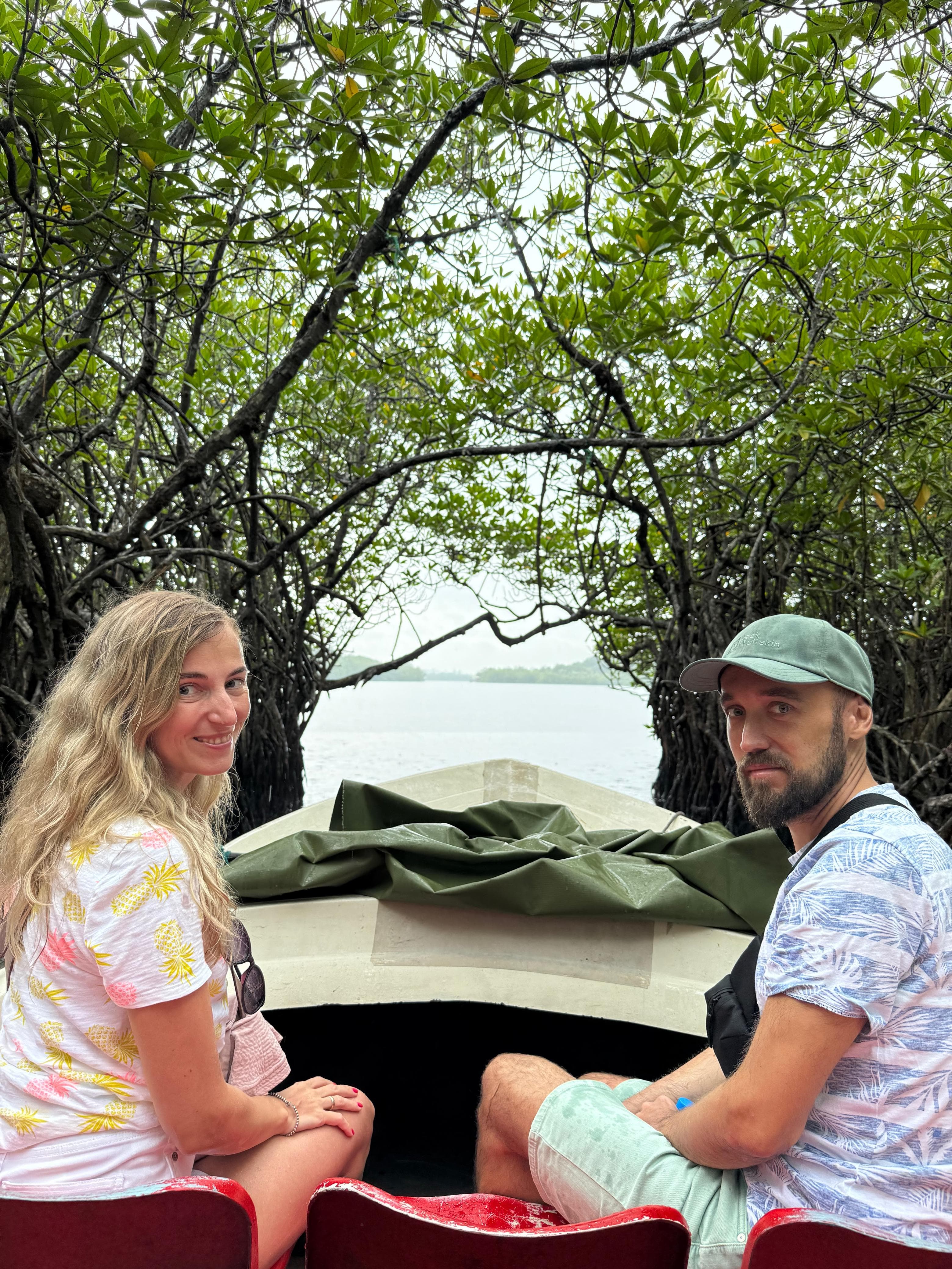 Couple on a mangrove boat safari on the Madu River